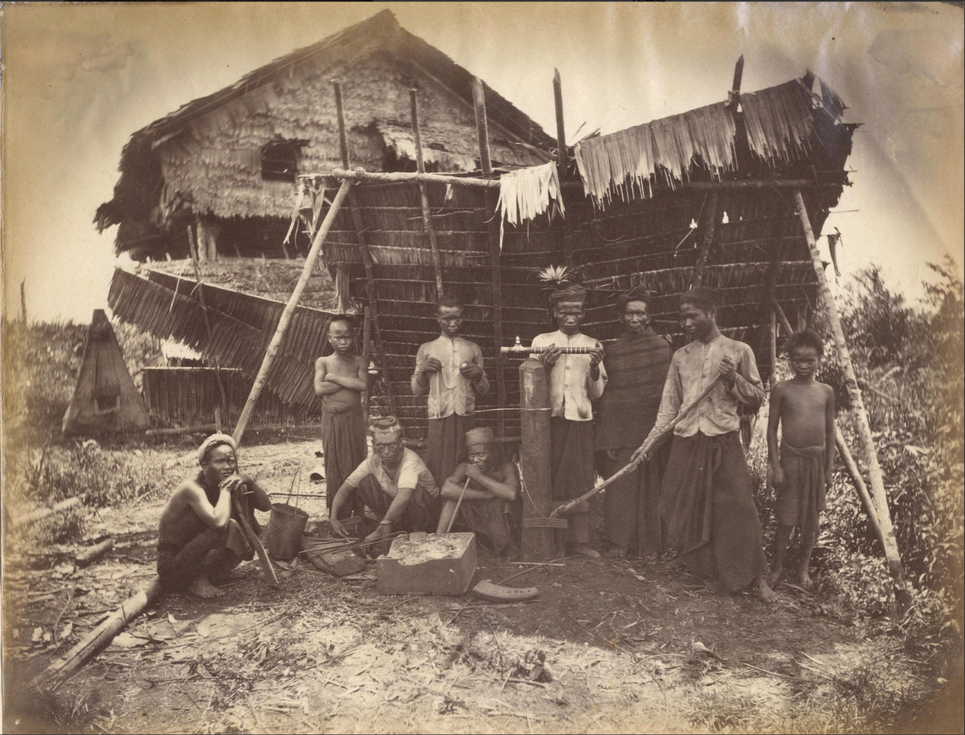 Sepia photo of boys dressed for manual labour.