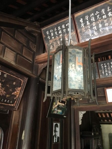 A wooden interior and a large lantern.