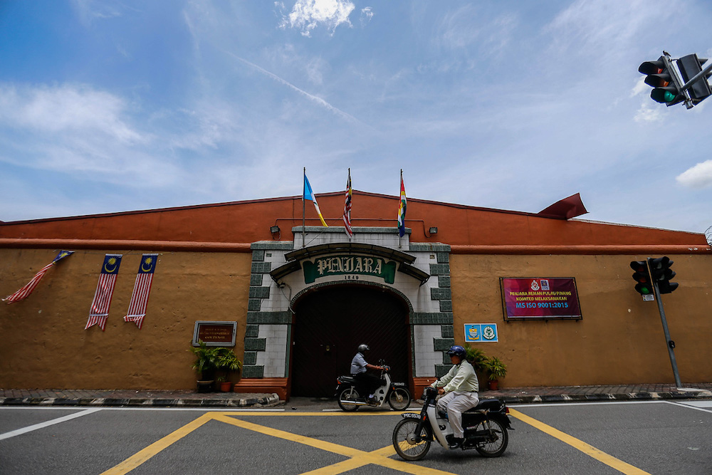 The Penang Jail as it is today. Flags fly above the entrance.