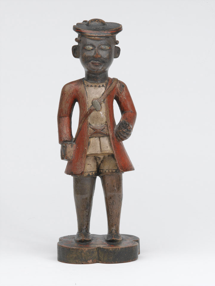 A wooden figurine of an infantryman.