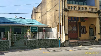 The green mosque and the yellow building next door to it.