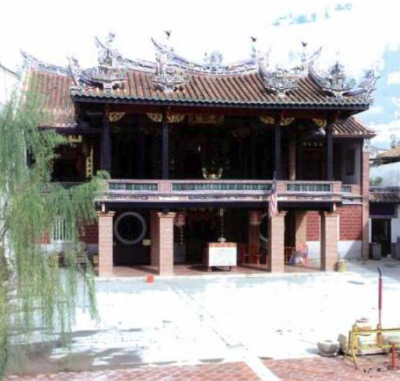 A temple with a tree out the front.