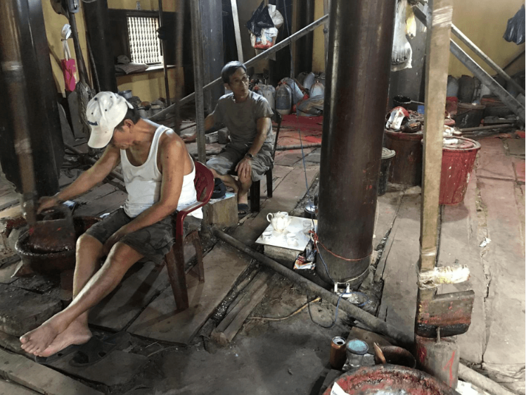 The artisans working on lacquer works, Hue City.