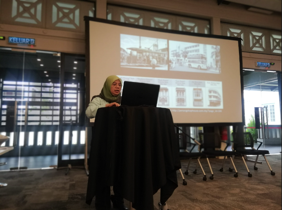 Sarena Abdullah presenting on early 20th-century art movements and visual culture in Penang.