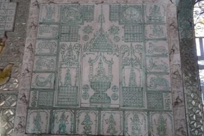 A 'diagram' in green on a temple wall.