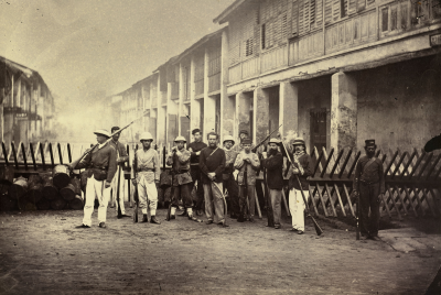 European soldiers gathered at a barricade.