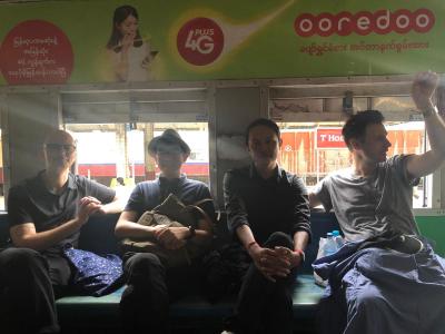 Four friends travelling on the train.