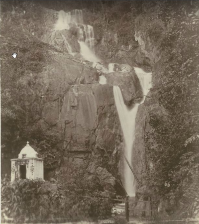 Black and white picture of sacred cleansing location. Waterfall visited by Malay performers. 