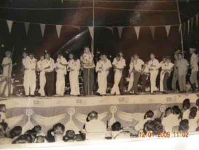 Portrayal of group performing on stage at Wembley Park.